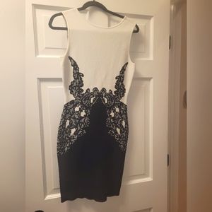 BCBGeneration worn black lace detail printed on material with back exposed back.